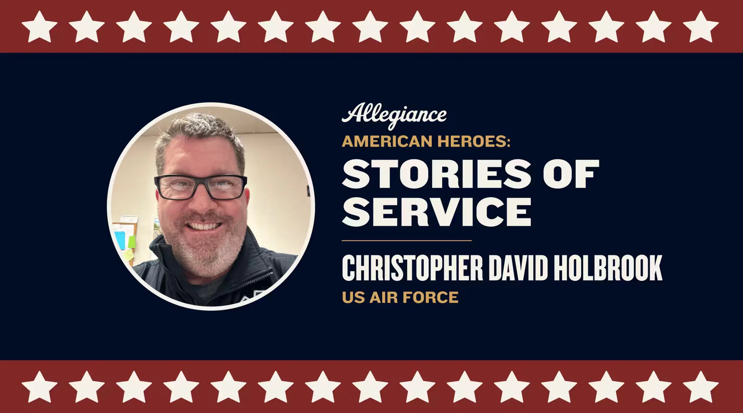 Christopher David Holbrook, US Air Force veteran, smiling & wearing glasses, with a neutral office background