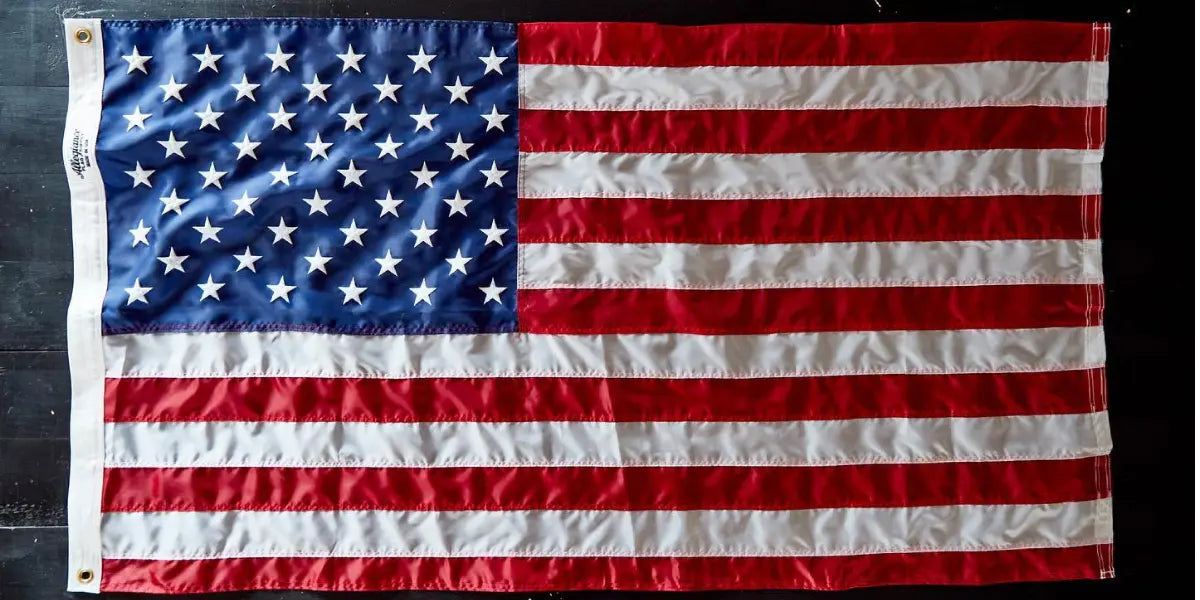 This high-quality American flag lays flat, showcasing the materials and stitching that demonstrate how American flags are made.